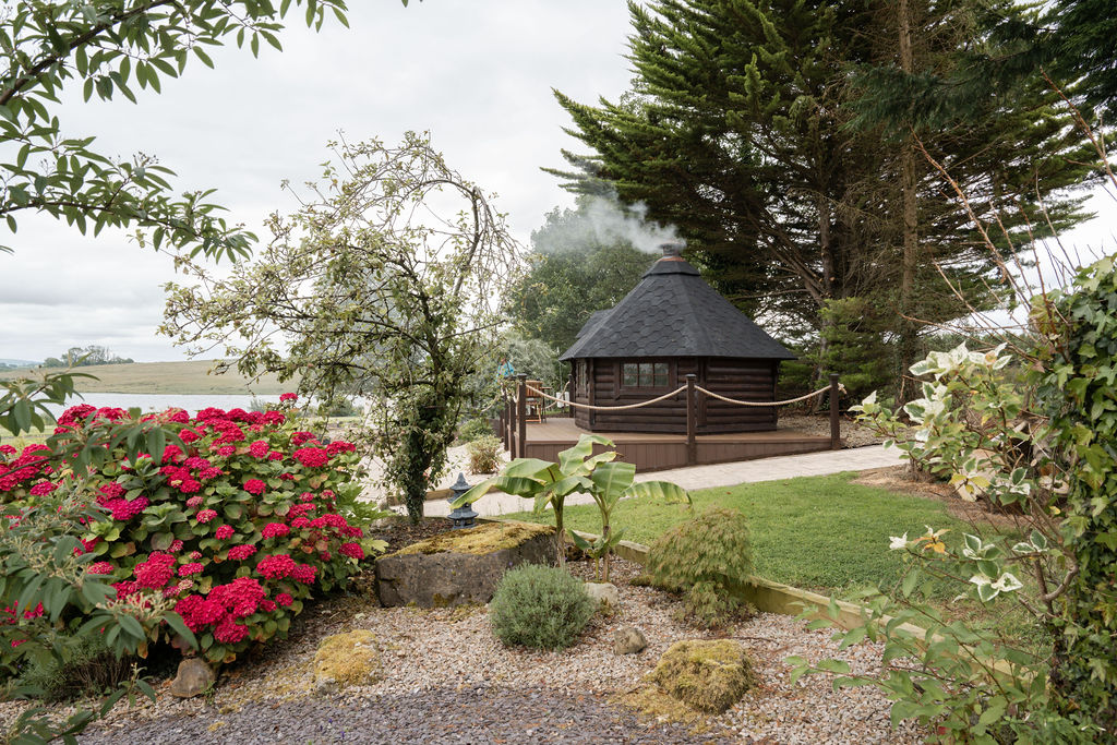 The BBQ hut tucked into the garden
